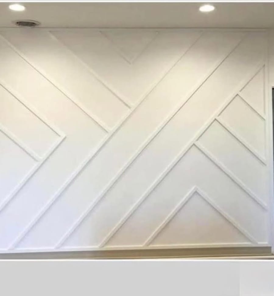 White chevron pattern accent wall panelling