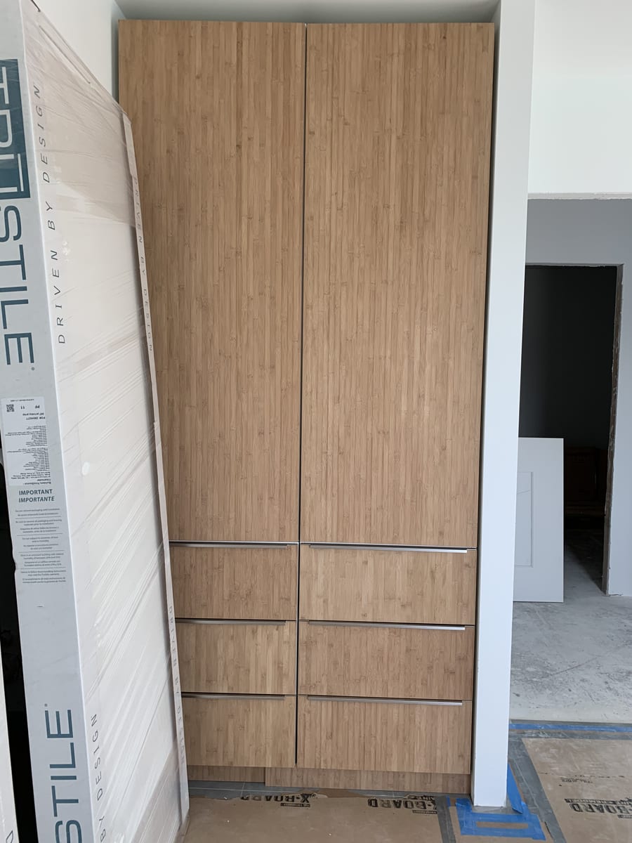 Built-in bamboo wardrobe closet with drawers, ready for installation