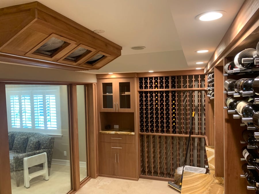 Wine cellar with timber racking and a lit soffit