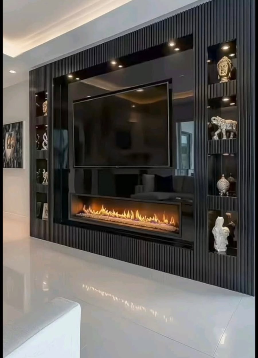 Black fluted TV wall with a linear fireplace and lit display niches